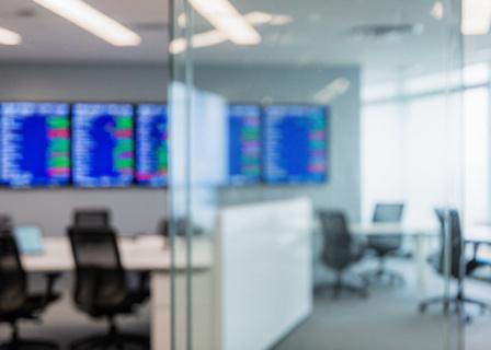 Modern financial trade floor with digital displays